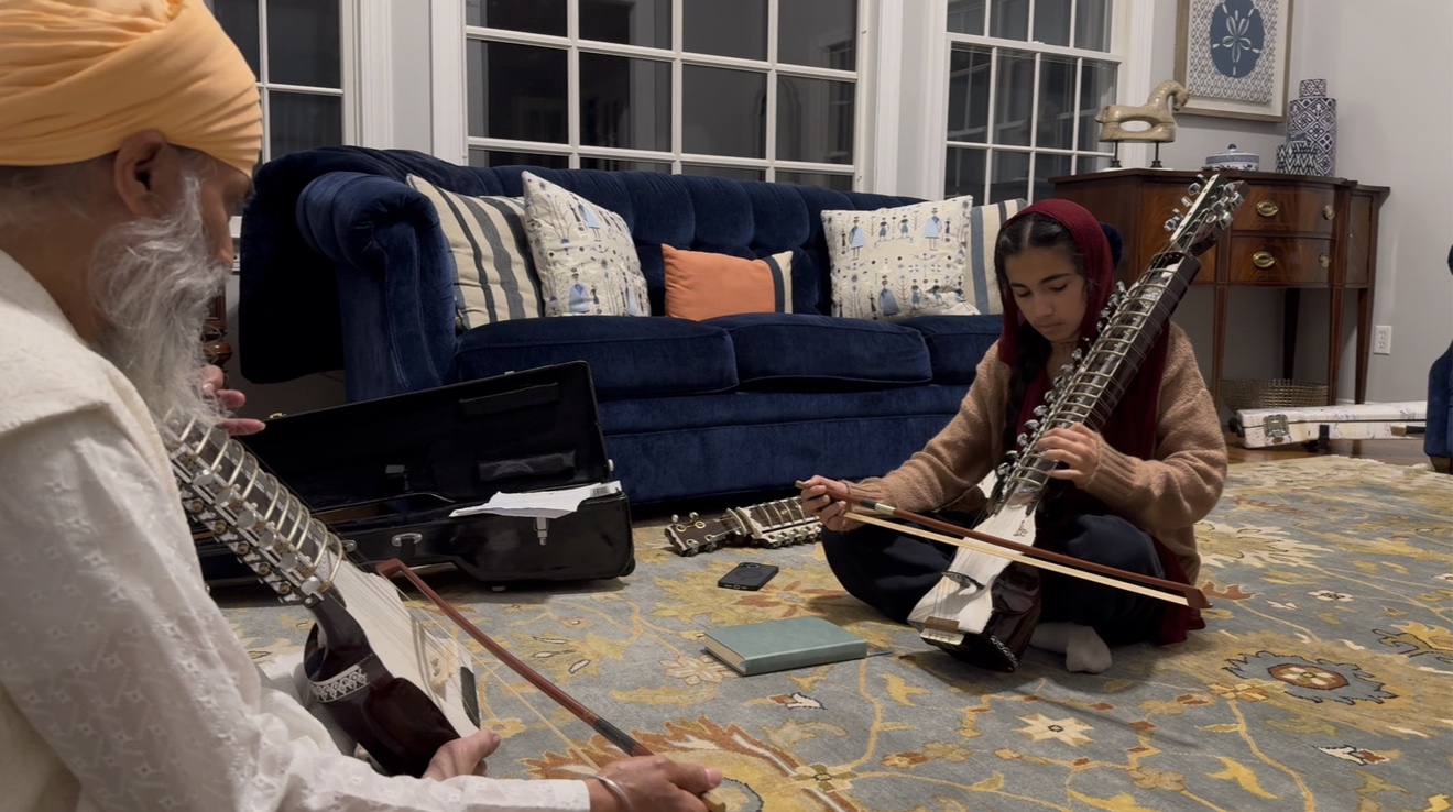 Parnaz playing dilruba with her ustad