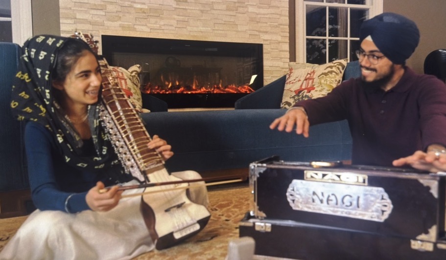Parnaz playing dilruba with her brother on harmonium