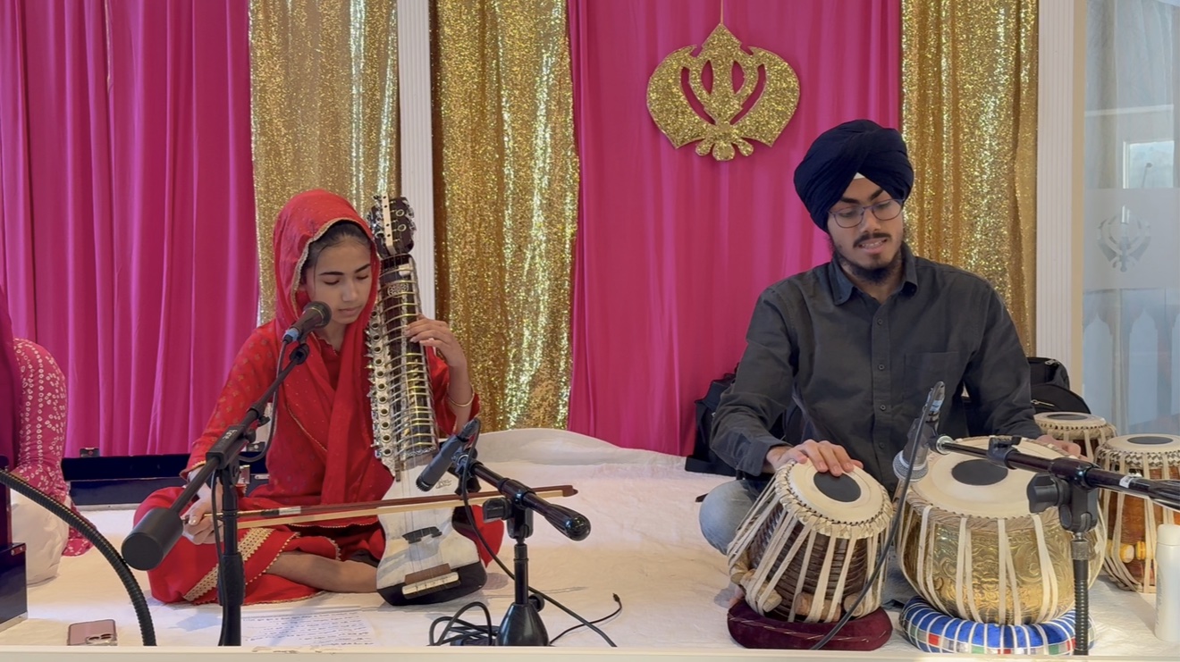 Parnaz and her brother performing on stage